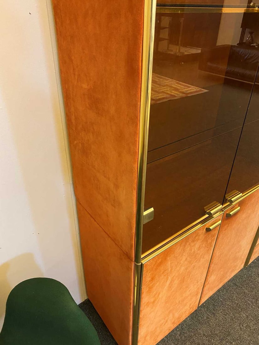Manner of Renato Zevi, a brass and orange suede wall cabinet, - 12