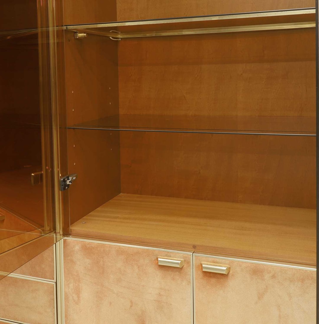Manner of Renato Zevi, a brass and orange suede wall cabinet, - 3