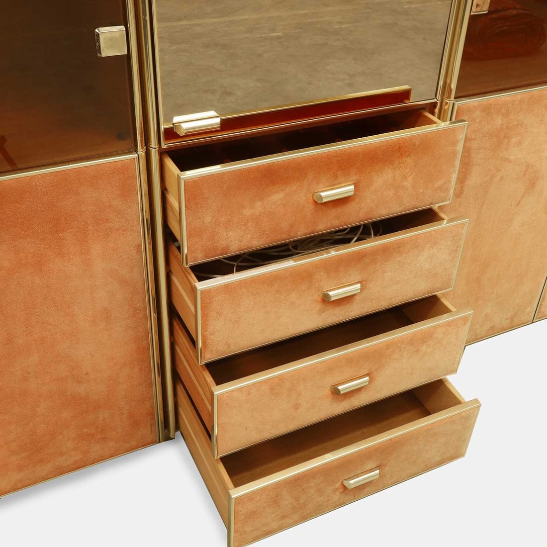 Manner of Renato Zevi, a brass and orange suede wall cabinet, - 5