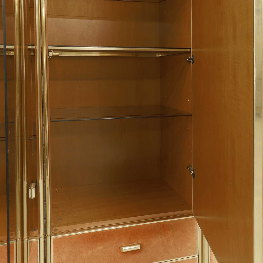 Manner of Renato Zevi, a brass and orange suede wall cabinet, - 6