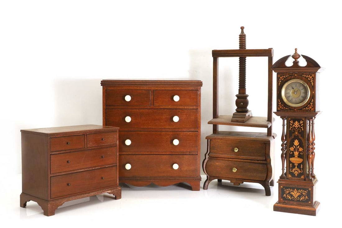An apprentice mahogany chest of drawers, 19th century,: An apprentice mahogany chest of drawers, 19th century, the moulded rectangular top above two short and three long drawers, fitted with turned bone handles, with shaped serpentine apron raised on