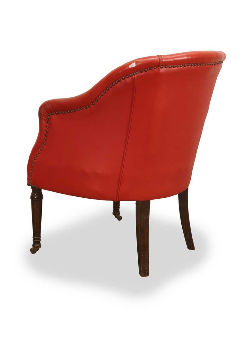 A red leatherette upholstered tub chair, 19th century, - 2