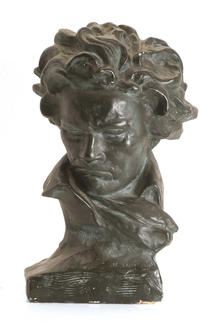 A black painted plaster bust of Ludvig van Beethoven, 20th century,: A black painted plaster bust of Ludvig van Beethoven, 20th century, after Ugo Cipriani, on an integral square socle base, signed indistinctly to the base 24cm wide, 40cm high