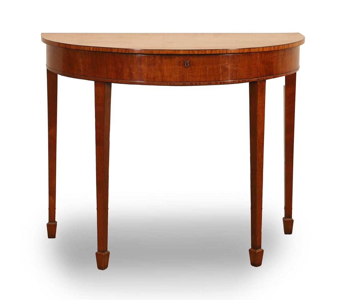 A Regency satinwood D shaped side table,: A Regency satinwood D shaped side table, with a lift up top, square section legs and spade feet 101cm wide, 56cm deep, 81cm high