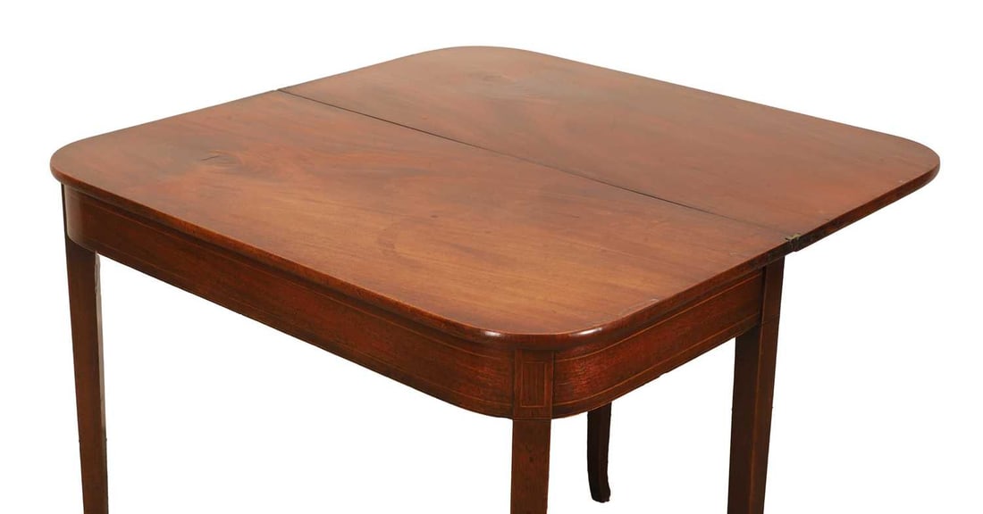 A mahogany fold over tea table. 19th century, - 2