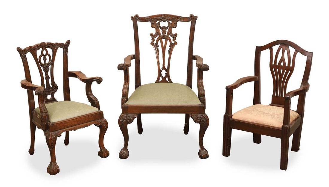 Three children's mahogany open armchairs 20th century,: Three children's mahogany open armchairs 20th century, comprising a near pair of George II style mahogany children's open armchairs, the shaped top rail centred by a foliate moulding, above a pierced 