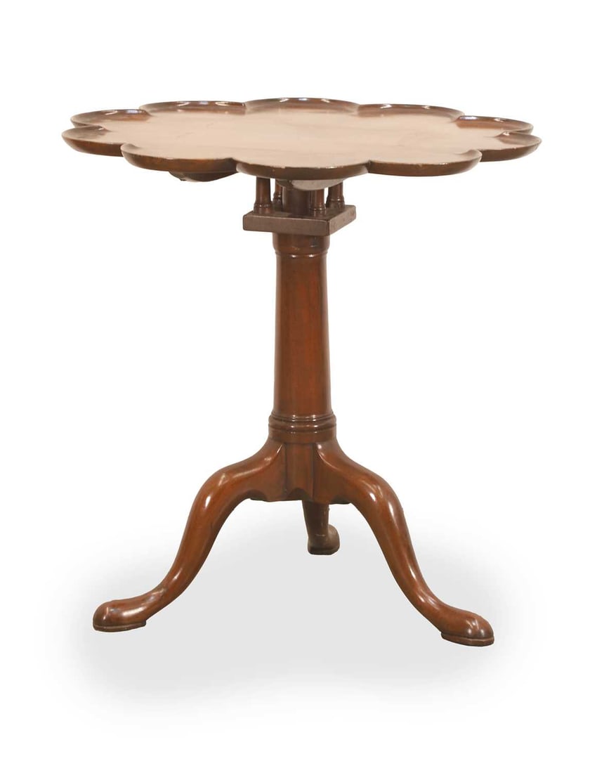 A tilt top wine table with a piecrust top 19th century,: A tilt top wine table with a piecrust top 19th century, and birdcage action, with turned column base raised on tripod legs, 68cm diameter, 68cm high