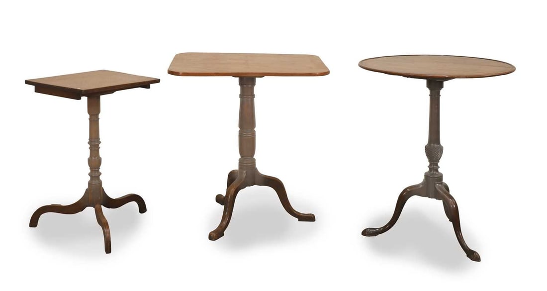 Two tilt top wine tables, 19th century,: Two tilt top wine tables, 19th century, both of rounded rectangular form, one with a reeded column and the other with a turned column, both terminating on tripod legs together with a smaller inlaid ex