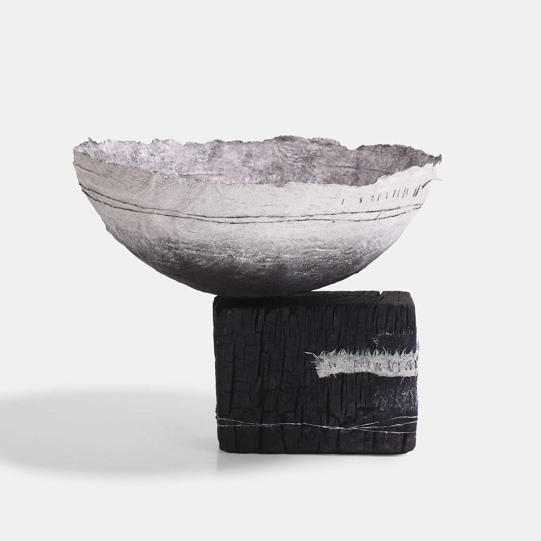 Gizella K Warburton (British, b.1965), 'Ritual Form VIII',: Gizella K Warburton (British, b.1965), 'Ritual Form VIII', painted fabric, mixed media, and blackened oak 26cm diameter, 21cm high 2 Provenance: The Steve Allison Collection; acquired from the