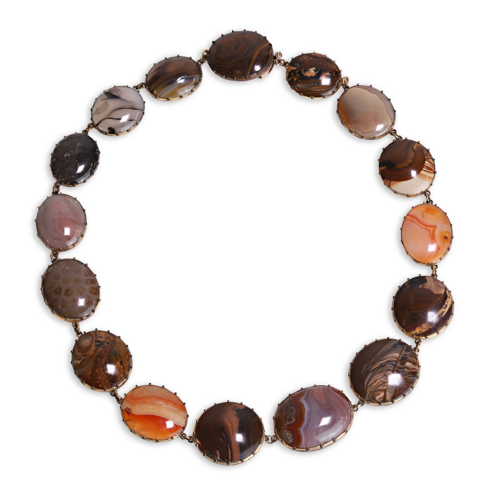 A Georgian hardstone panel necklace,: A Georgian hardstone panel necklace, comprising a series of hardstone plaques, including various banded agates, fossilised coral and jaspers of differing sizes and colours, all in cut-down settings. E