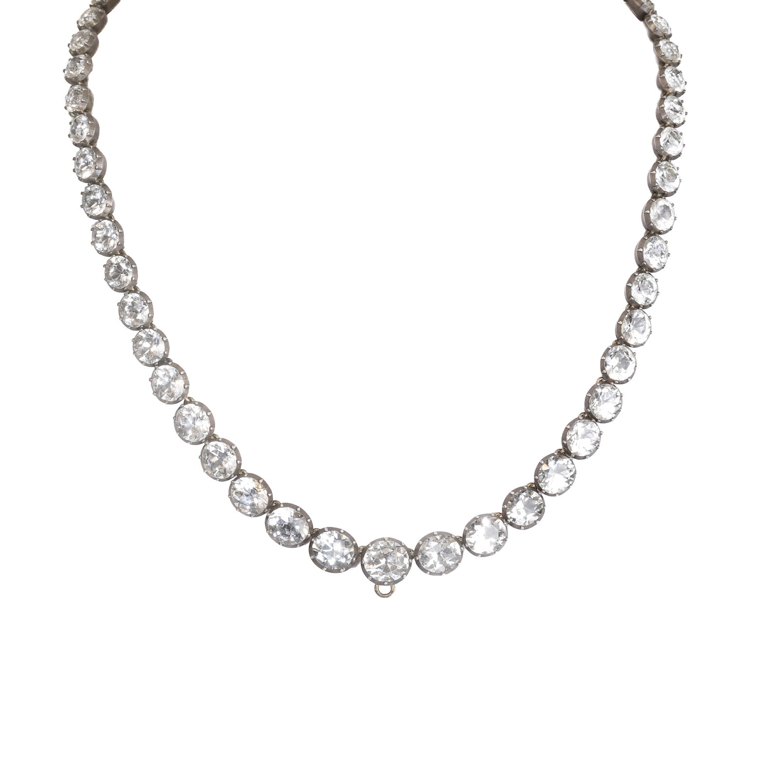 A Georgian white topaz rivière necklace,: A Georgian white topaz rivière necklace, composed of fifty-four graduated round cut white topaz in closed back, cut down settings, ranging from 8.10 to 4.70mm with integral box clasp. Unmarked, t