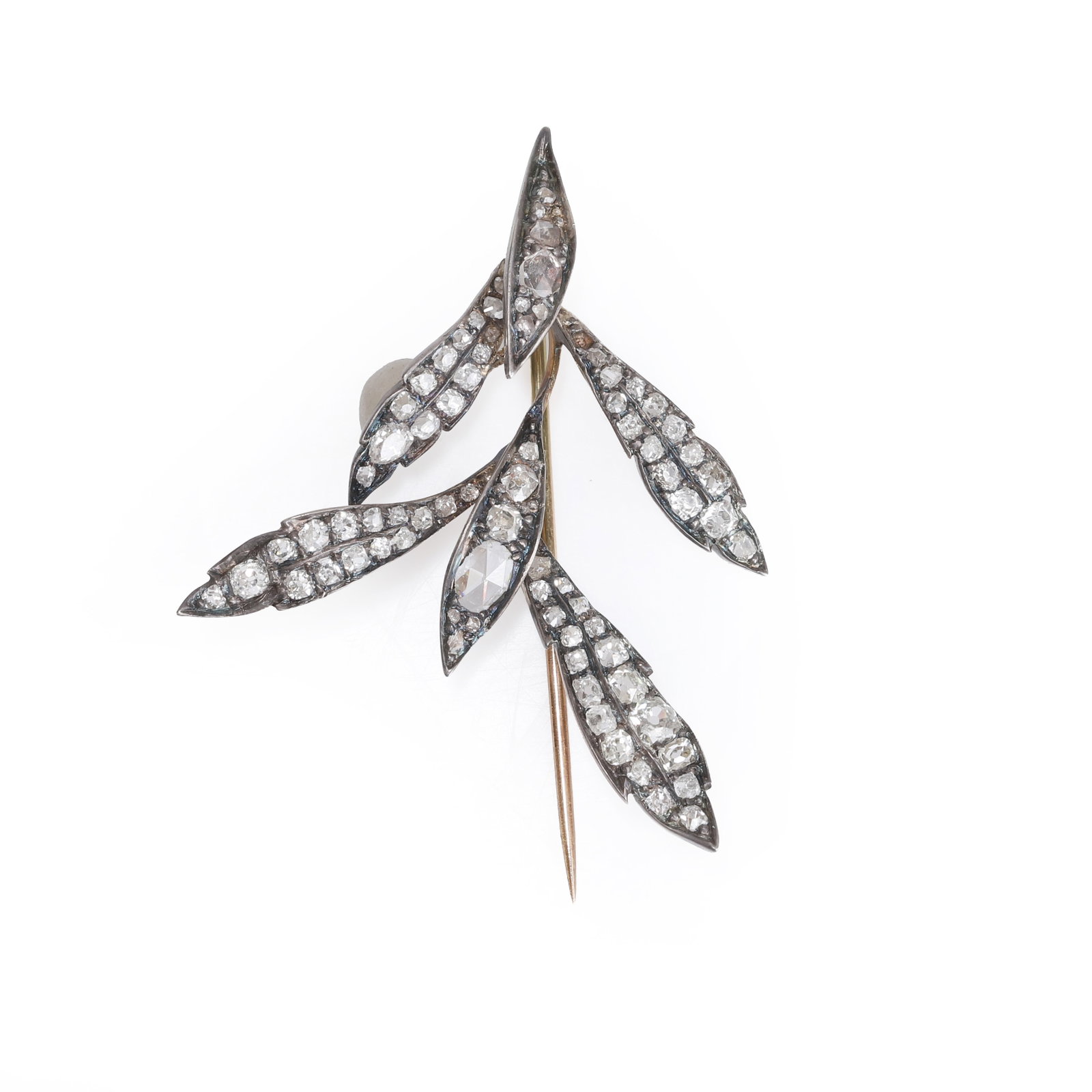 An antique diamond leaf pin,: An antique diamond leaf pin, set with rose cut and cushion shaped old cut diamonds with a fixed stick pin. Unmarked, tested as approximately 9ct gold and silver (Length 5.6cm; 6.8g) Condition Report: 
