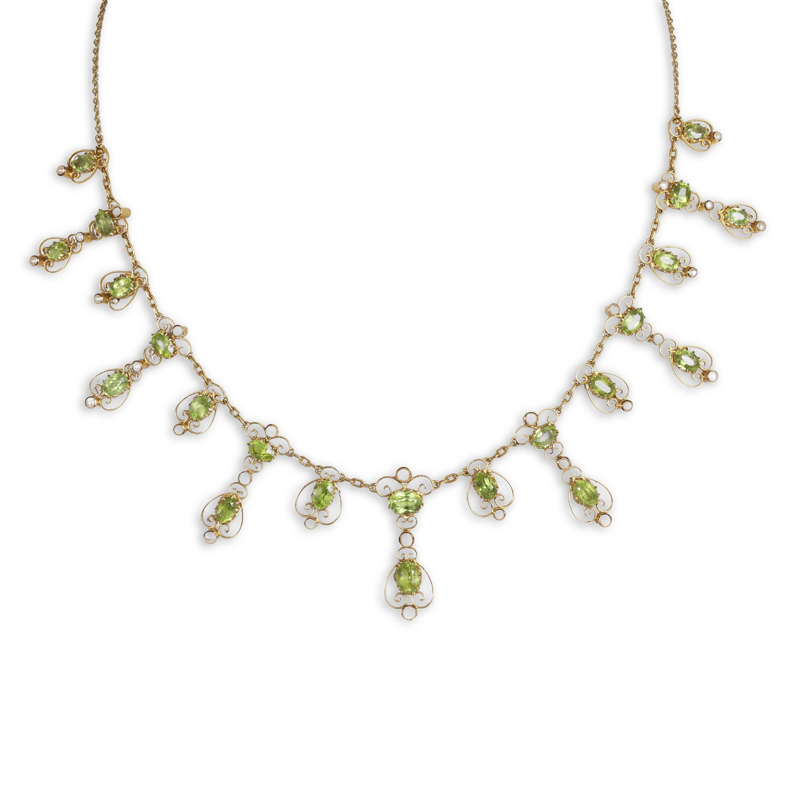 An early 20th century peridot and seed pearl fringe necklace, retailed by Liberty & Co,: An early 20th century peridot and seed pearl fringe necklace, retailed by Liberty & Co, comprising a peridot and split pearl centrepiece in alternating two and one stone arrangements, the oval cut per