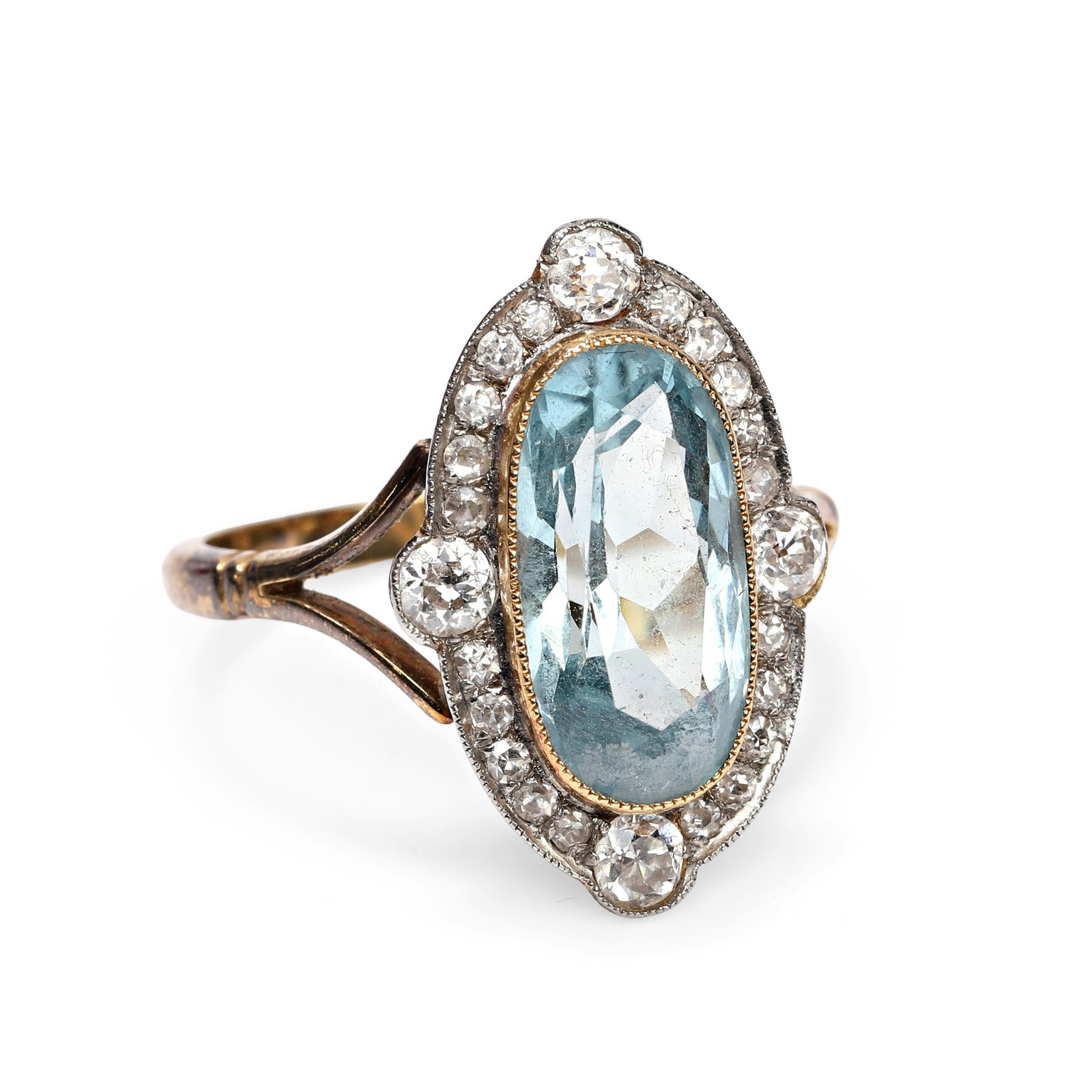 An aquamarine and diamond ring,: An aquamarine and diamond ring, the oval cut aquamarine within a border of eight cut diamonds, accented by four old European cut diamonds at the compass points, all mounted in a pierced gallery betwee