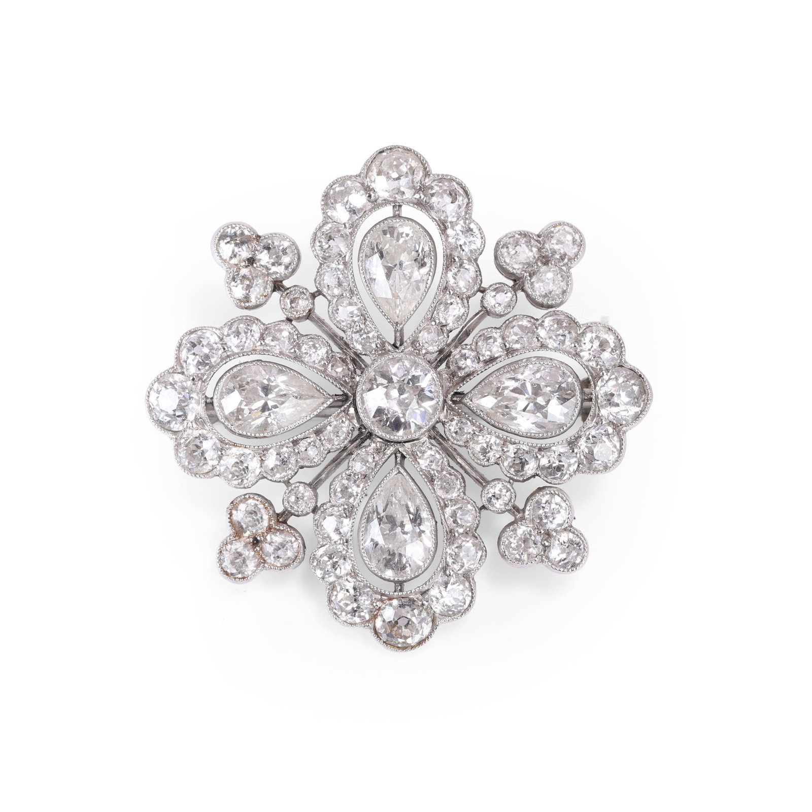 An early 20th century diamond brooch,: An early 20th century diamond brooch, of quatrefoil form, comprising a central old European cut diamond with four pear shaped diamonds, millegrain set and radiating, each with an open halo of graduate