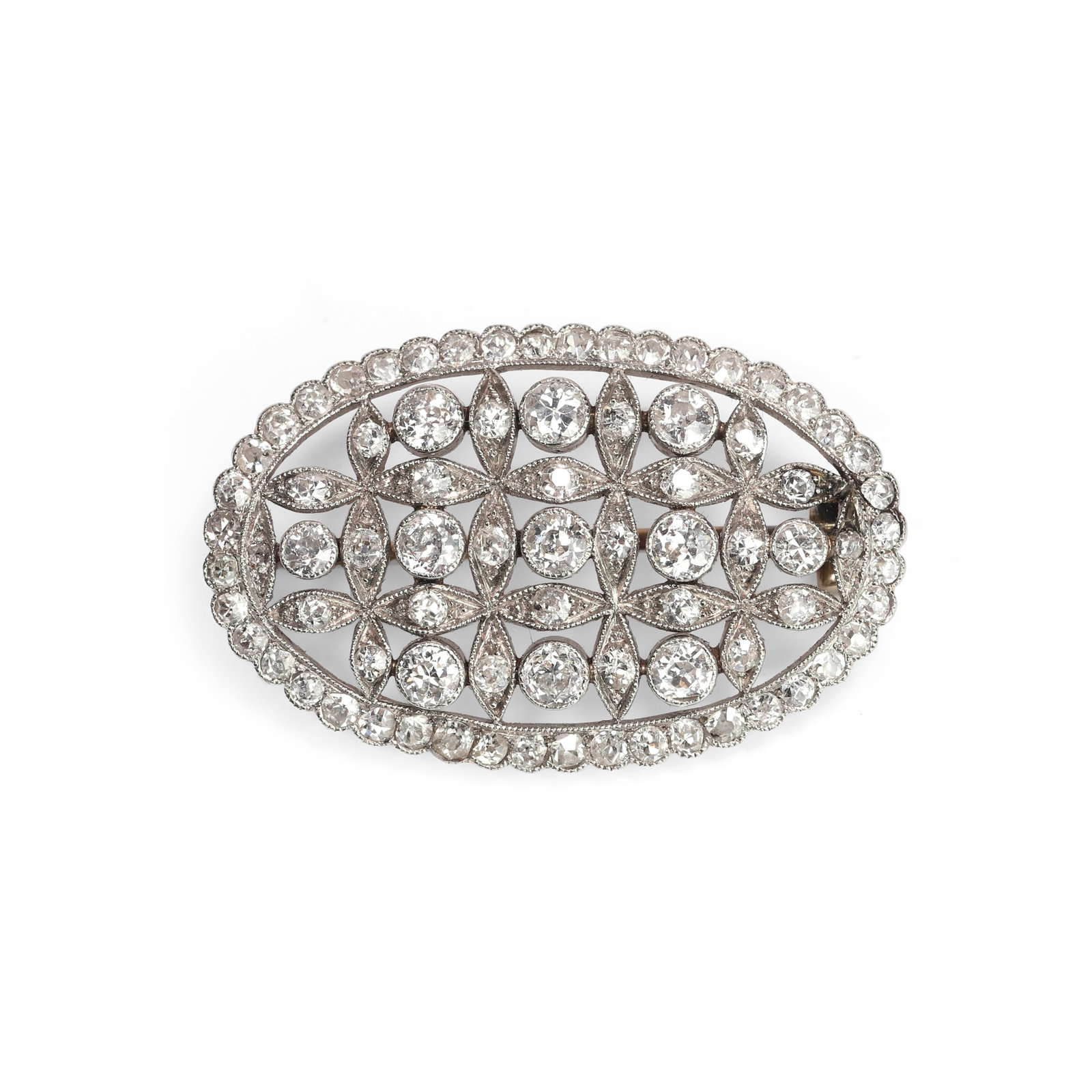 A Belle Époque diamond brooch,: A Belle Époque diamond brooch, the oval pierced plaque set throughout with vari-sized old European and eight cut diamonds in quatrefoil motifs, framed by an outer border of eight cut diamonds, te