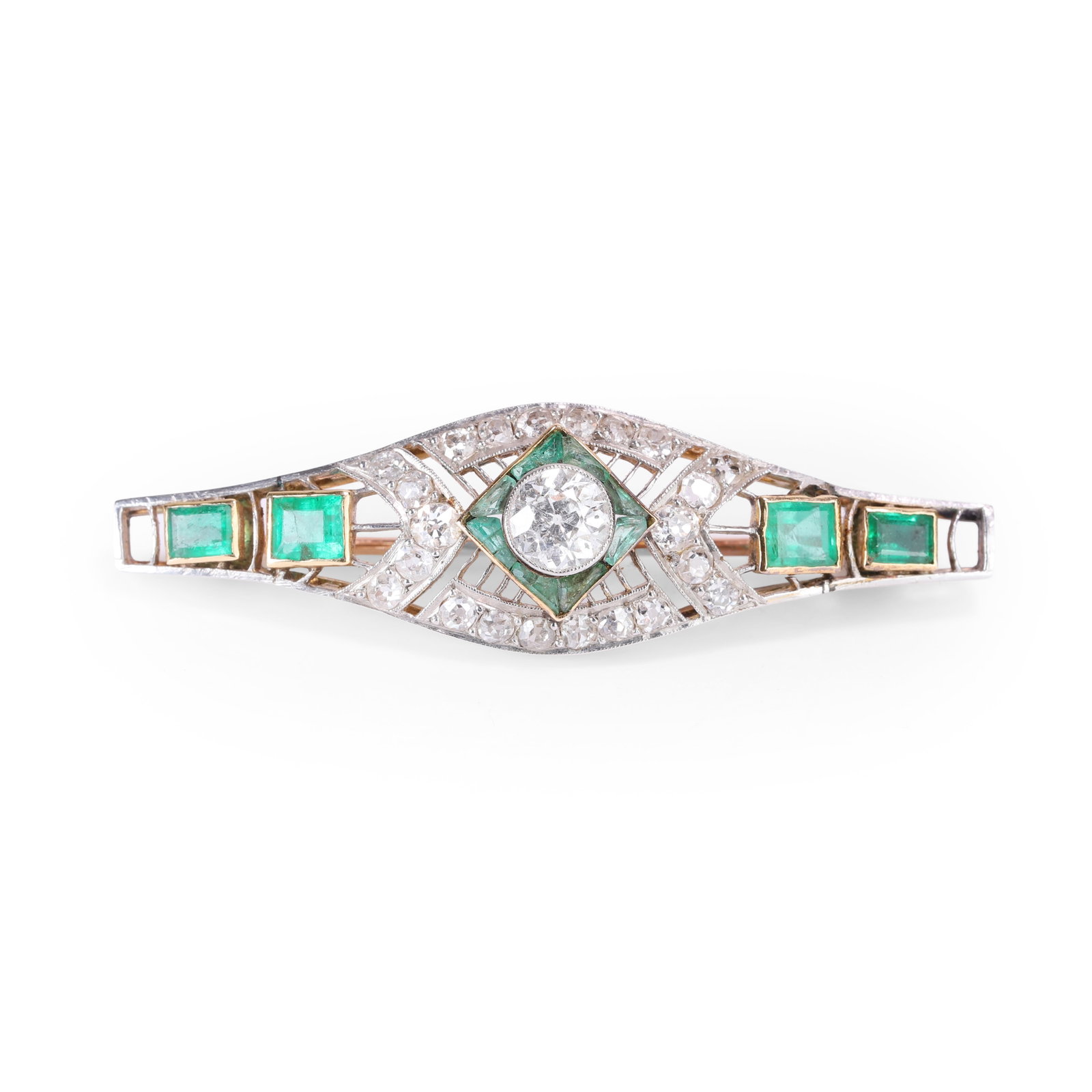 An early 20th century emerald and diamond plaque brooch,: An early 20th century emerald and diamond plaque brooch, the lozenge openwork panel with a central old European cut diamond within a square border of calibre cut emeralds and a surround of old Europea