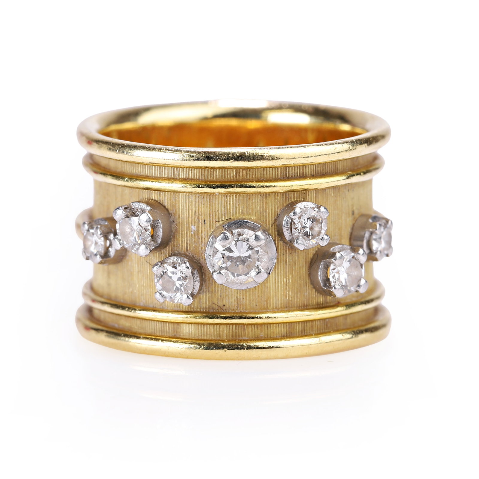Leo de Vroomen, an 18ct gold diamond ring,: Leo de Vroomen, an 18ct gold diamond ring, the broad textured band with graduated round brilliant diamonds in raised white collets, between polished gold borders, maker's mark LDV for Leo de Vroomen, 