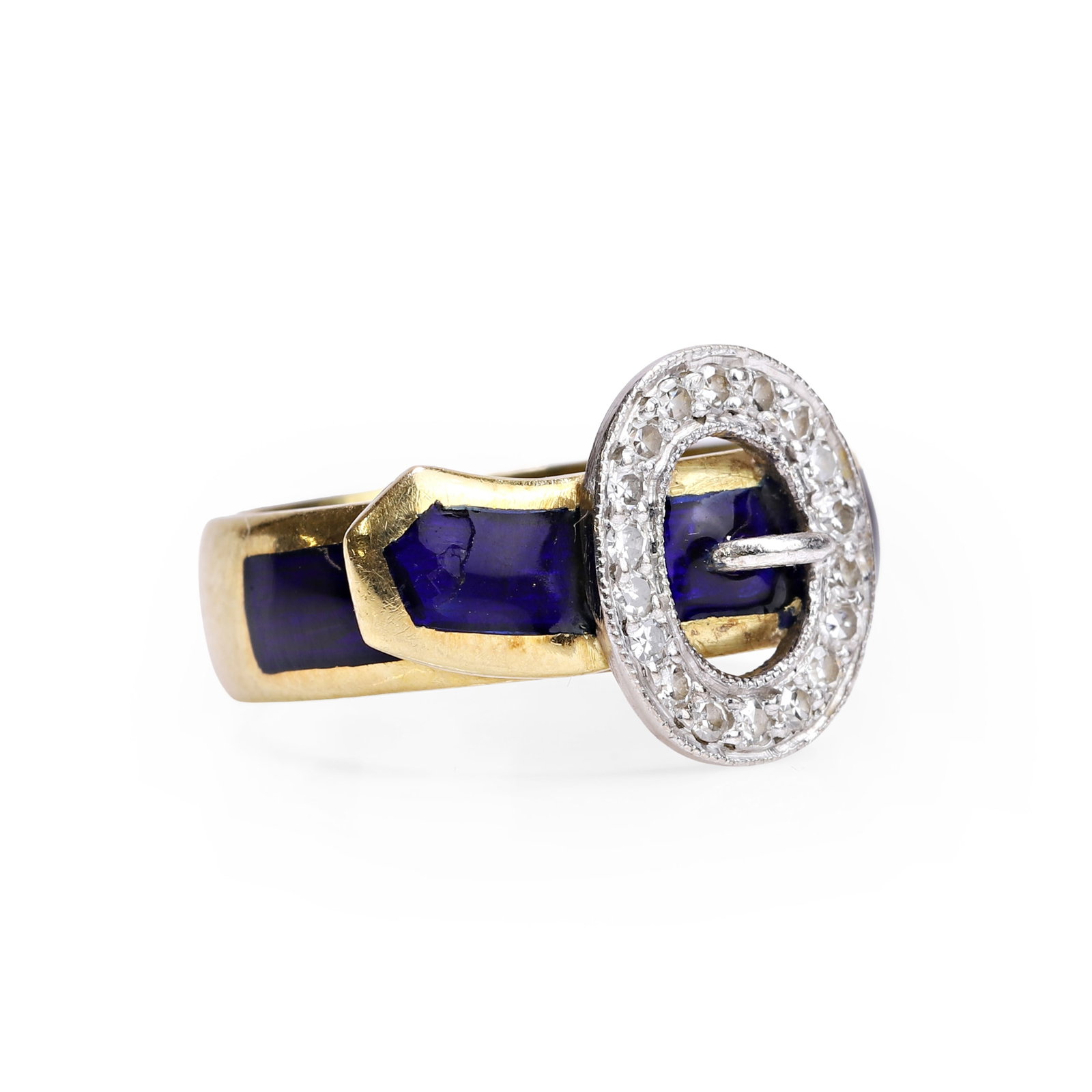 An 18ct diamond and enamel buckle ring,: An 18ct diamond and enamel buckle ring, centrally featuring a buckle set with single cut diamonds, to a band embellished with blue enamel, hallmarked London 1985 (Ring size I½; 5.8g) Footnote: Bu