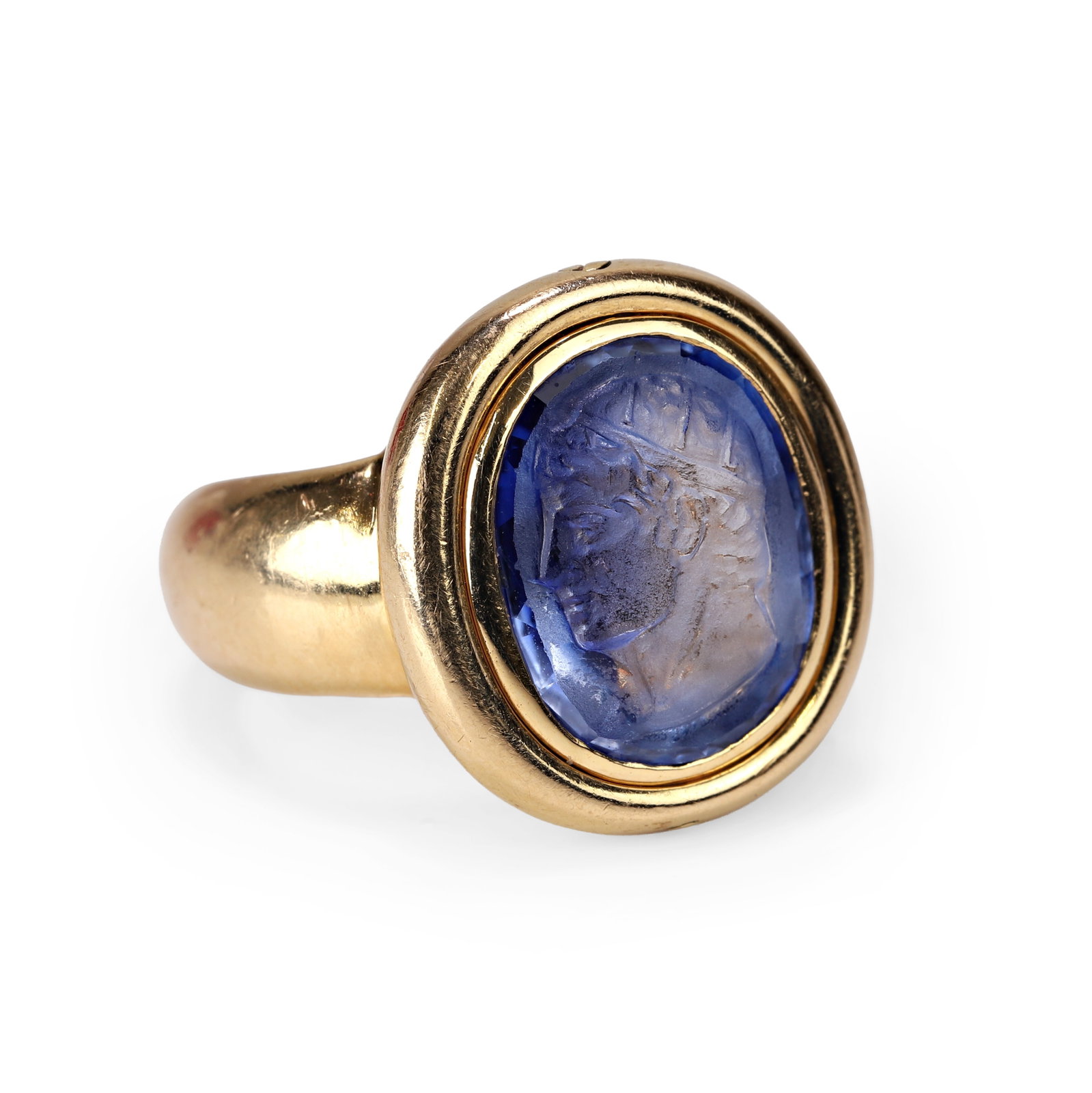 Benoit de Gorski, an 18ct gold sapphire cameo ring,: Benoit de Gorski, an 18ct gold sapphire cameo ring, the oval shaped engraved sapphire, carved with a classical male bust in profile, within a rub over setting, into a tapering band. Stamped 750, marke