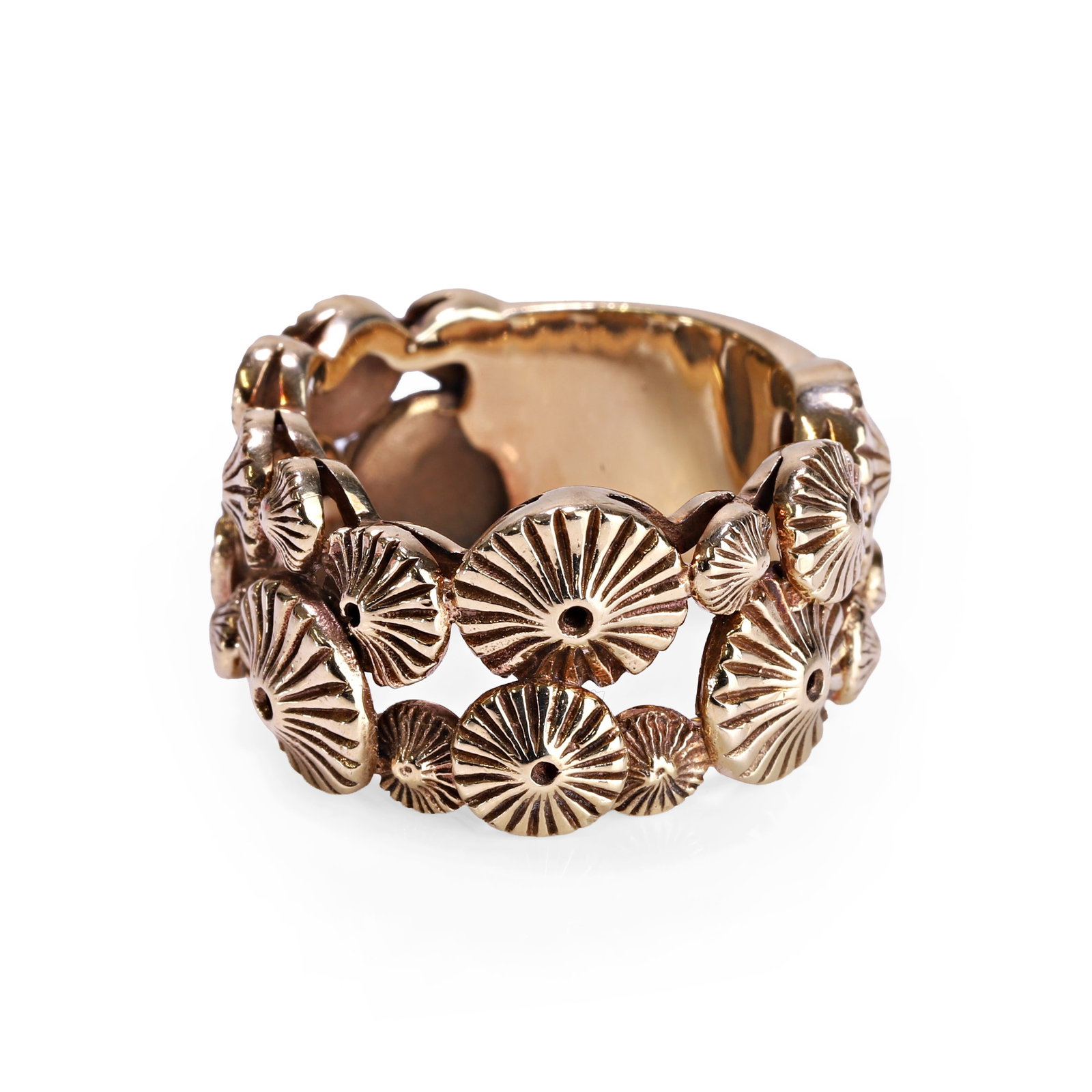 An abstract design ring, retailed by Cassandra Goad,: An abstract design ring, retailed by Cassandra Goad, modelled as a cluster of disc-shaped organic formations with reeded finish, leading to a plain hoop, unmarked and tested as 9ct gold. In a Cassandr