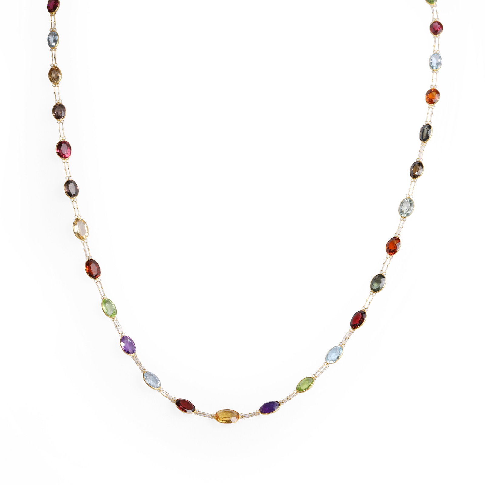 A multi-gemstone necklace,: A multi-gemstone necklace, spectacle set with a single line of graduated oval cut vari-coloured gemstones, including amethyst, citrine, garnet, peridot, smoky quartz, topaz, etc, each to doubled fette