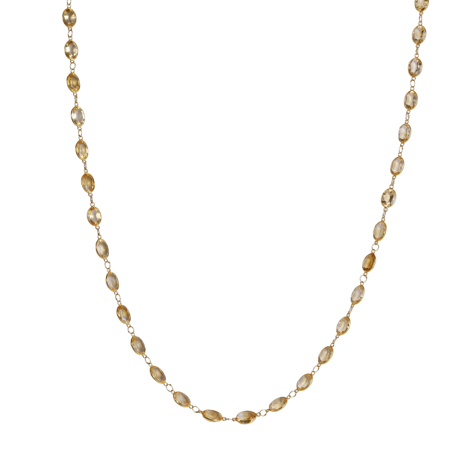 A citrine set necklace,: A citrine set necklace, spectacle set with a single line of oval cut citrine, each alternating to a fine jump ring link, to an 'S' shaped clasp, stamped 585, tested as approximately 14ct gold (Length 