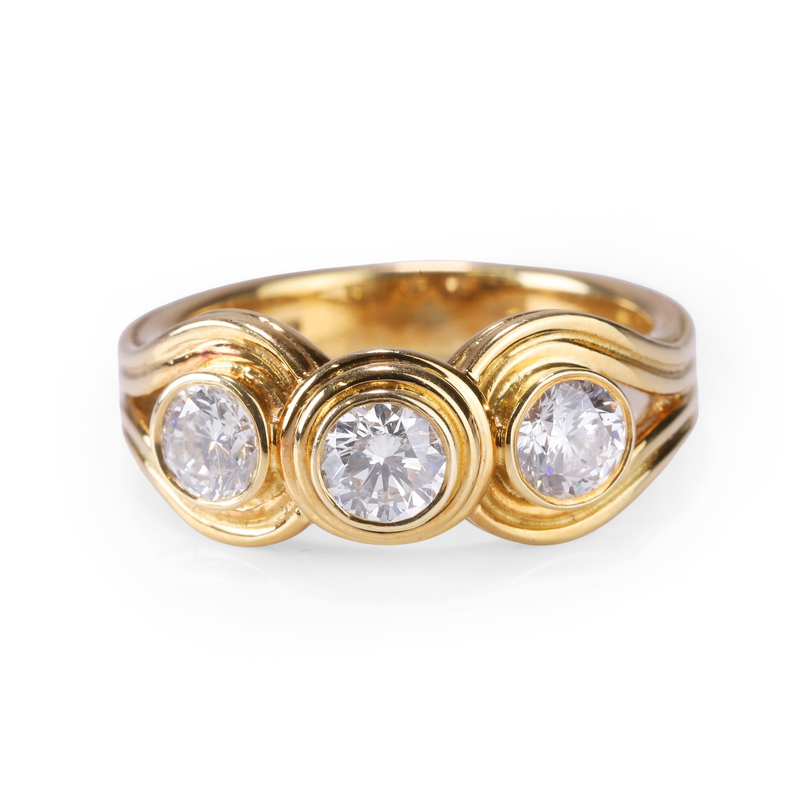 An 18ct gold diamond three stone ring, (1 of 2)
