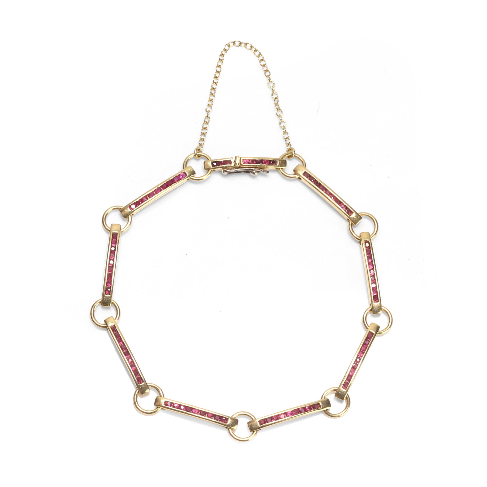A ruby bar link bracelet,: A ruby bar link bracelet, composed of bar links channel set with round cut rubies, and joined by jump rings, leading to a box clasp and safety chain, stamped 18k Italy, 750 (18.8cm; 11.3g) Condition R
