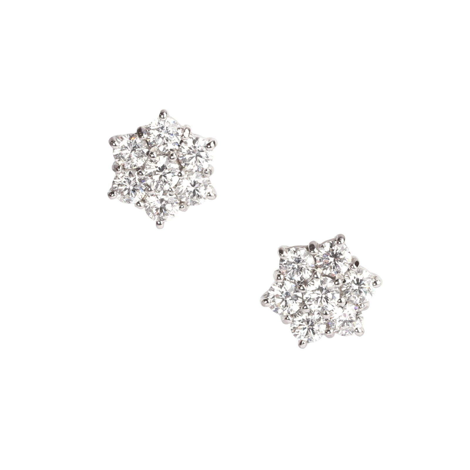A pair of diamond cluster stud earrings,: A pair of diamond cluster stud earrings, each comprising seven round brilliant cut diamonds, claw set in white gold to yellow gold post and butterfly, hallmarked London 2020, total diamond weight appr