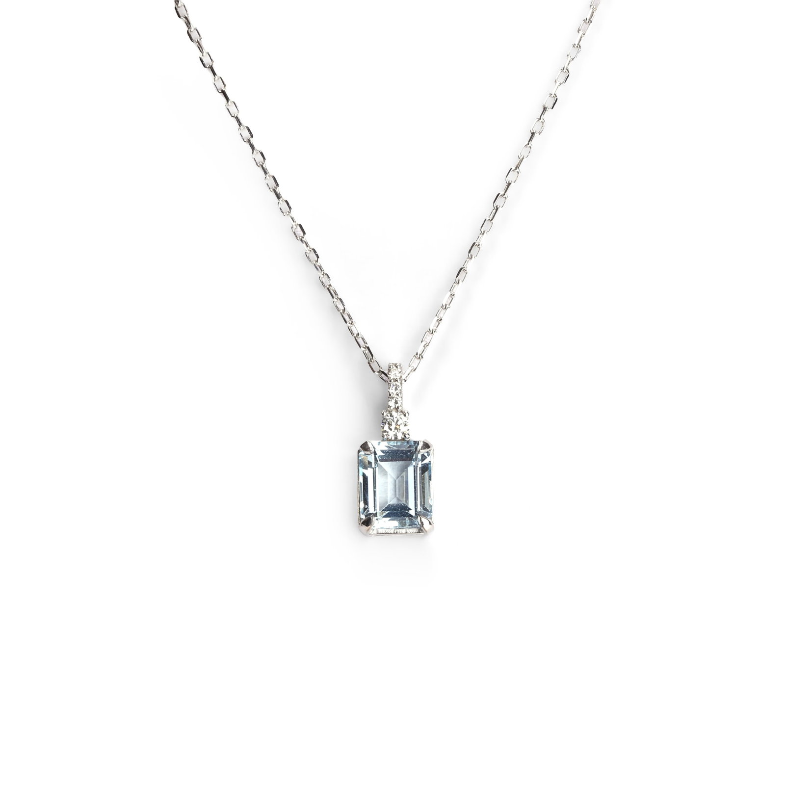 An aquamarine and diamond pendant necklace,: An aquamarine and diamond pendant necklace, the emerald cut aquamarine suspended from a round brilliant cut diamond surmount, mounted in white metal, on a white gold trace link chain stamped 'Mioro'