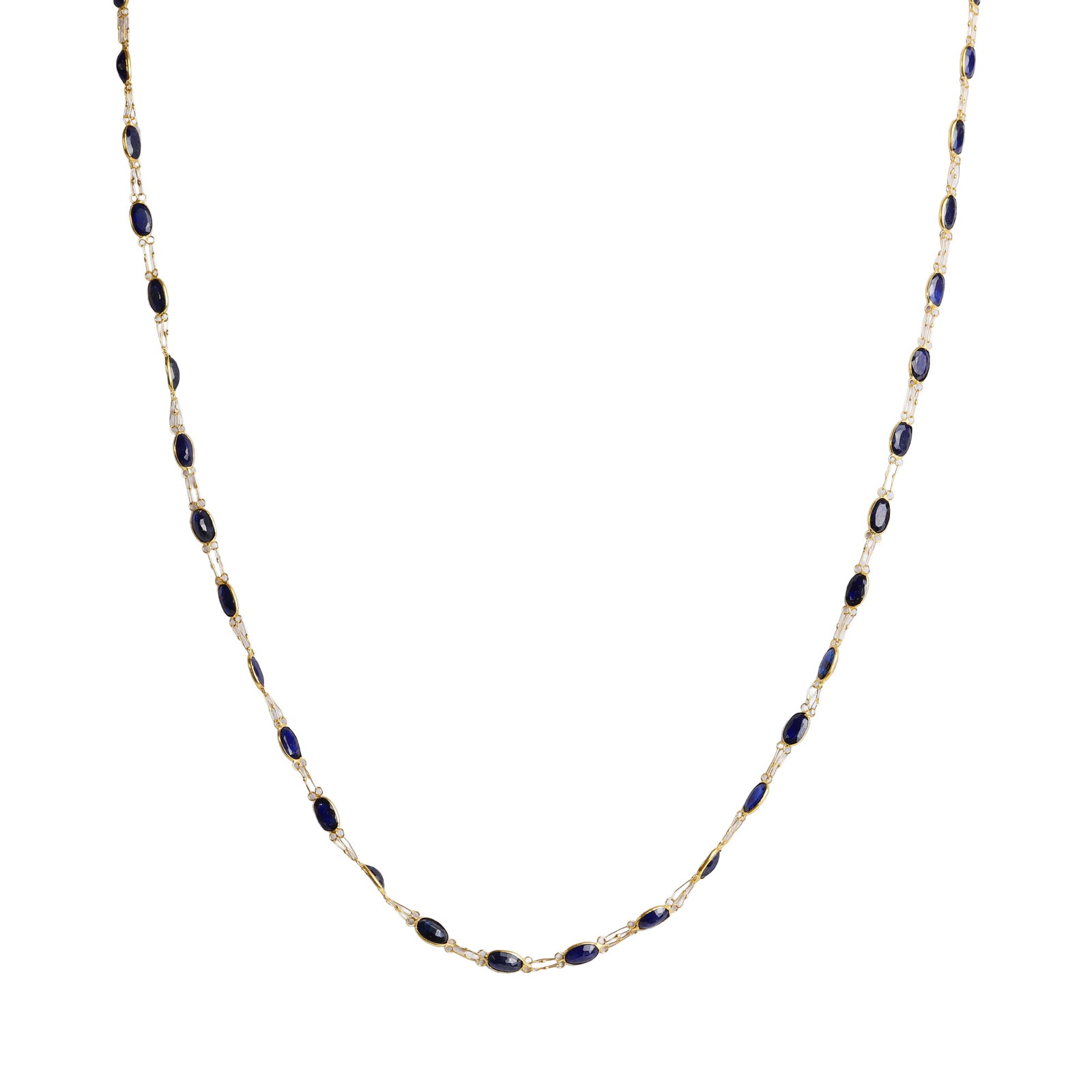 A sapphire set necklace,: A sapphire set necklace, spectacle set with a single line of uniform oval cut sapphires, each alternating to doubled fetter links, to an 'S' shaped clasp, tested as approximately 14ct gold (Length