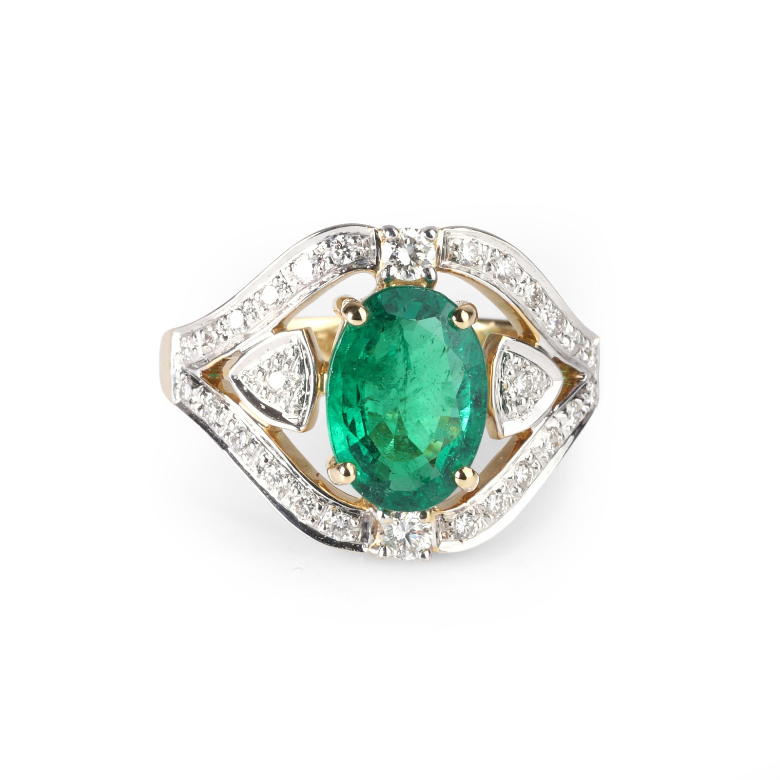 An 18ct gold emerald and diamond ring,: An 18ct gold emerald and diamond ring, the oval emerald claw set and flanked by pave set triangular accents and all enclosed by tread and grain diamond set shaped surround to a gently tapering D shape
