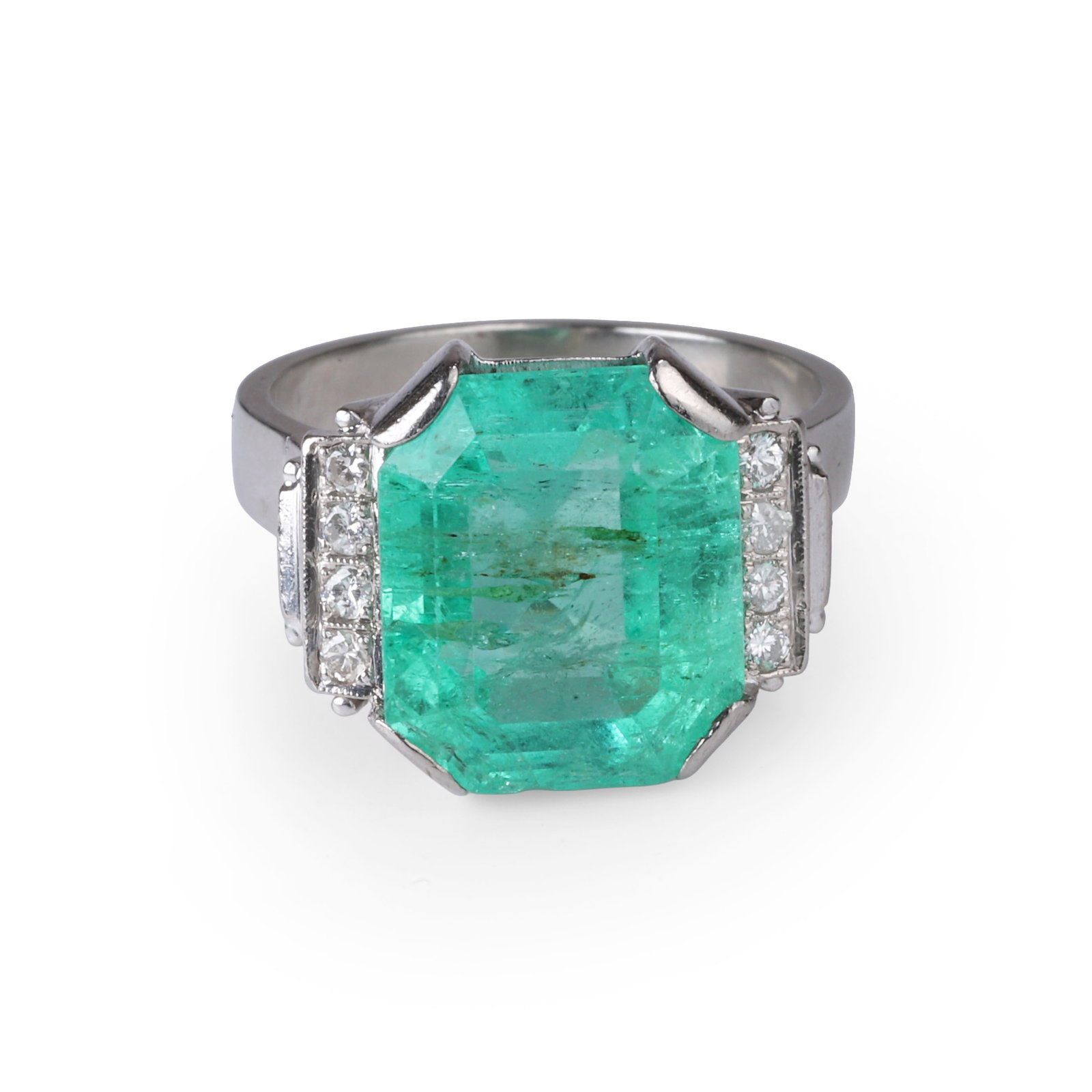 A Colombian emerald and diamond ring,: A Colombian emerald and diamond ring, the octagonal step cut emerald, weighing approximately 8.00ct, corner claw set between elevated diamond shoulders leading to a plain hoop . Stamped S.N. 585, test