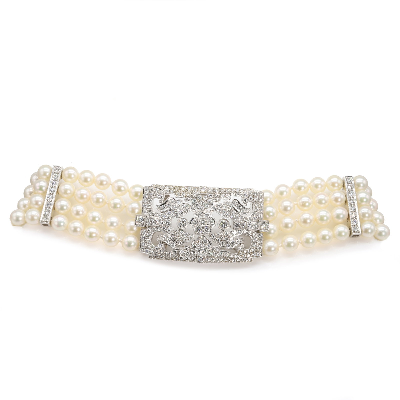 A cultured pearl and diamond choker with detachable diamond plaque,: A cultured pearl and diamond choker with detachable diamond plaque, composed of four rows of uniform cultured pearls, 6.50 to 6.90mm, spaced with three diamond set bars, to an openwork detachable plaq