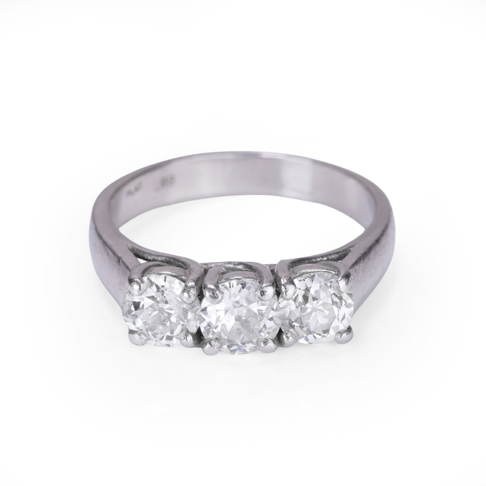 A diamond three stone ring,: A diamond three stone ring, claw set with three old European diamonds, totalling approximately 2.25ct, mounted in white metal stamped 'Plat', testing as platinum (Ring size U½; 9.5g) Footnote: Bu