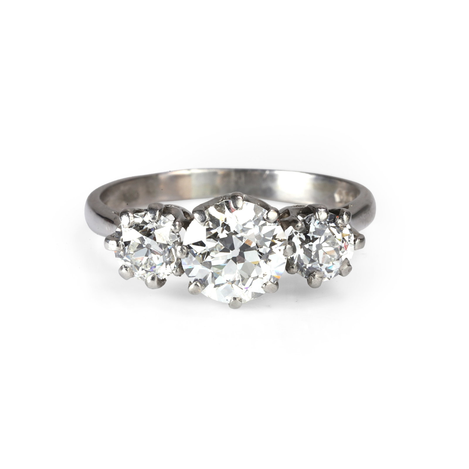 A diamond three stone ring,: A diamond three stone ring, with graduated transitional cut diamonds, claw set in rex collets, into tapered shoulders and a 'D' profile shank, total diamond weight estimated approximately 2.80ct, cent