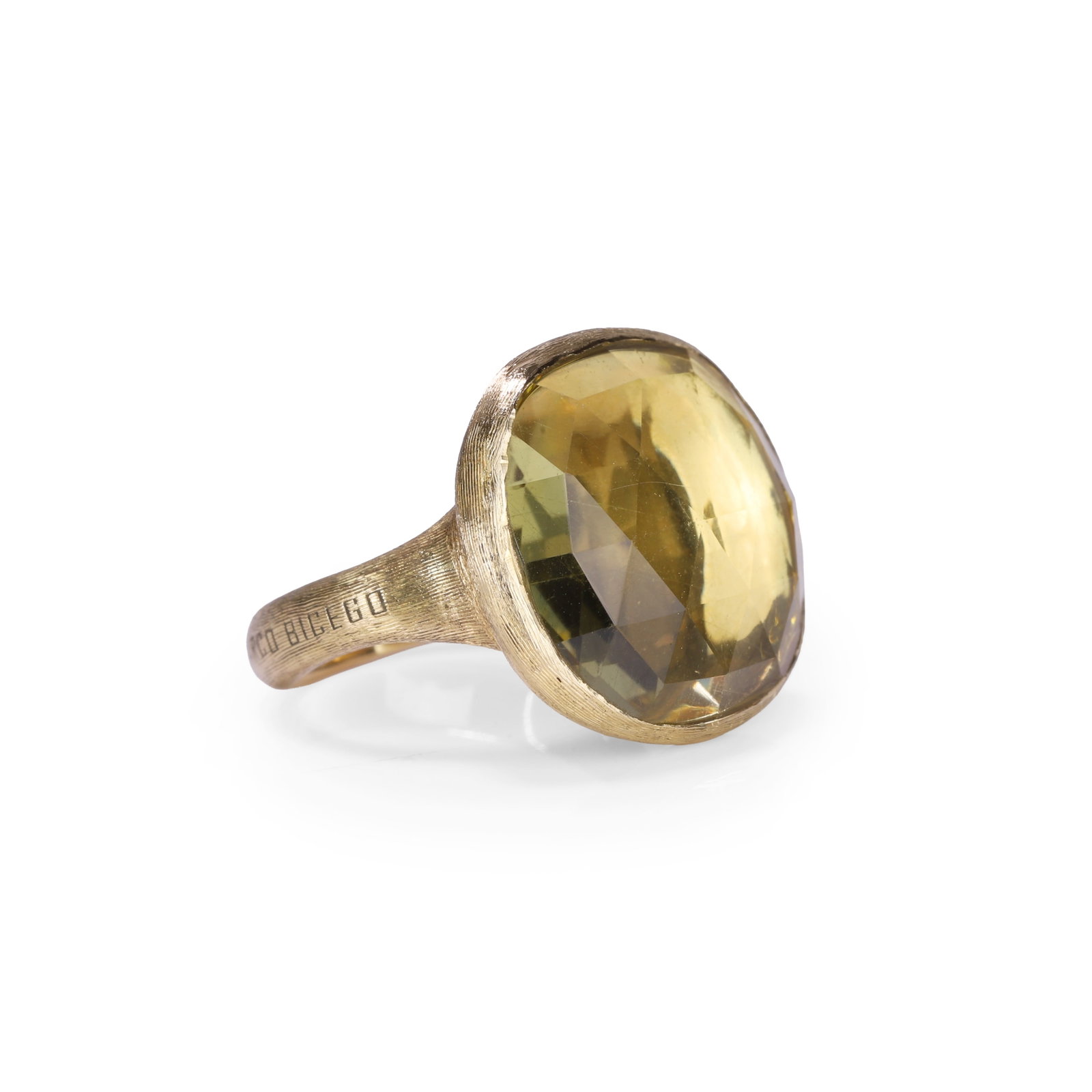 Marco Bicego, an 18ct gold and citrine Jaipur ring,: Marco Bicego, an 18ct gold and citrine Jaipur ring, the cushion shape checkerboard cut citrine within a textured bezel setting and shoulders, leading to a polished hoop. Signed Marco Bicego, hallmarke