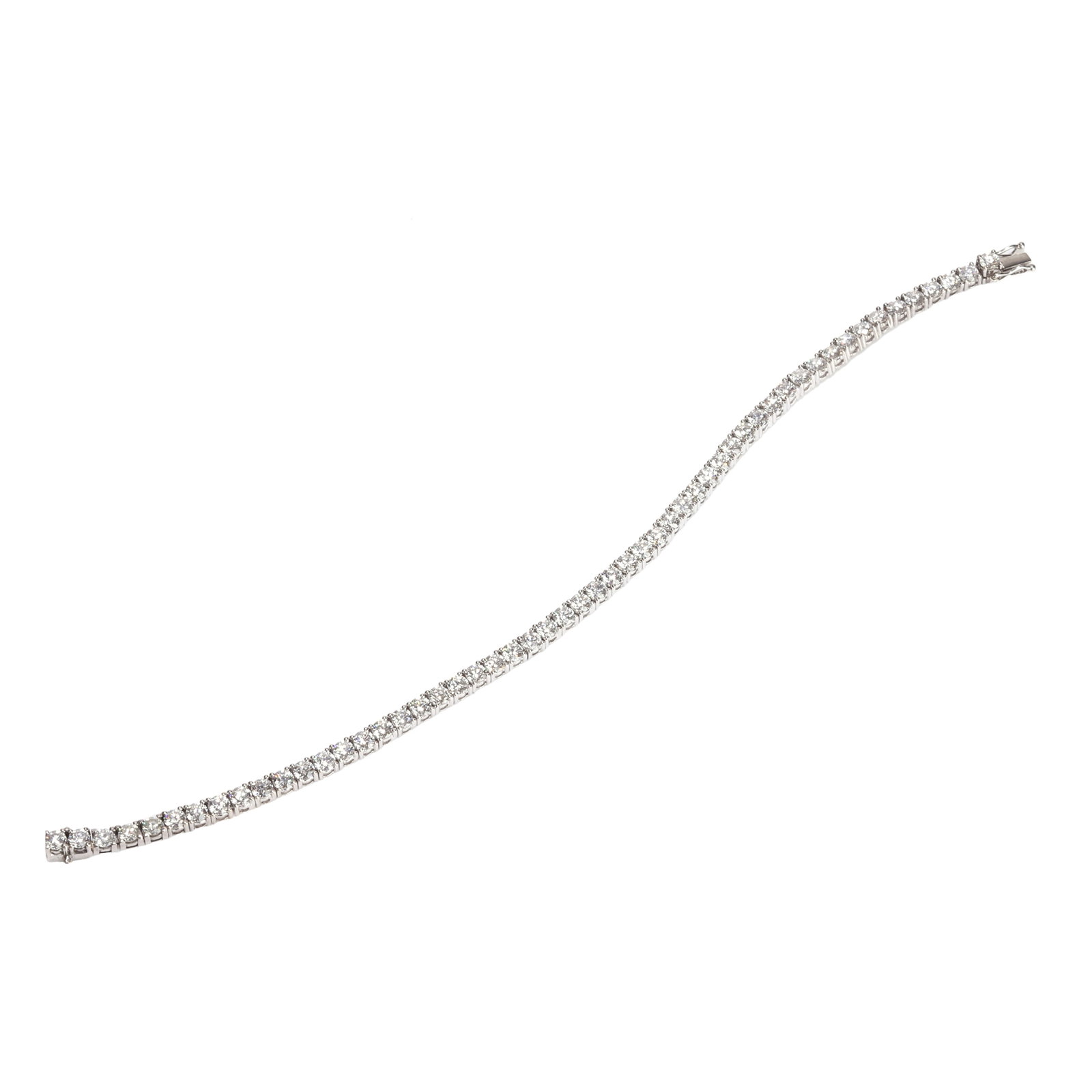 A diamond line bracelet,: A diamond line bracelet, set throughout with round brilliant cut diamonds in articulated collets, total diamond weight approximately 7.00ct, in white metal stamped 750 and testing as approximately