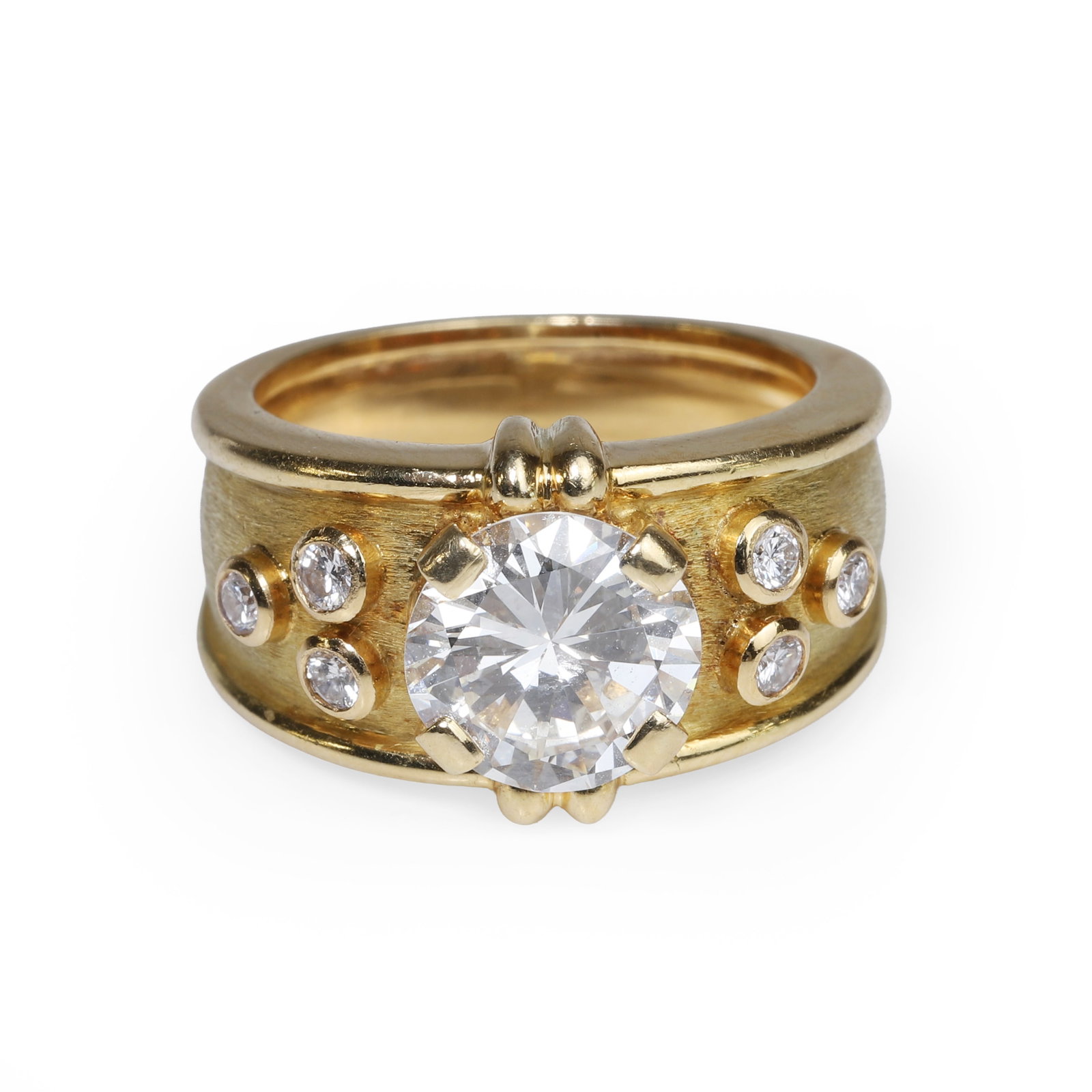 An 18ct gold diamond ring,: An 18ct gold diamond ring, the round brilliant cut diamond, estimated as approximately 2.40ct, claw-set at the centre, flanked by three collet set round brilliant cut diamonds on each side, to a taper