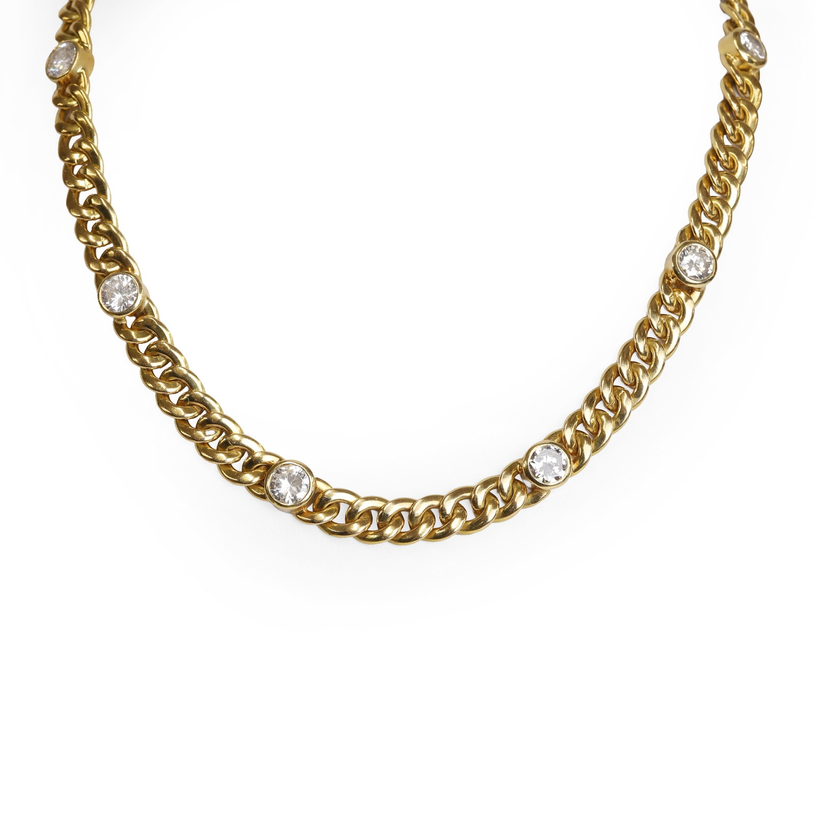 A diamond necklace,: A diamond necklace, designed as a solid curb link chain highlighted with eight collet set round brilliant cut diamonds, Italian marks, 750 convention mark, total diamond weight estimated as approximat