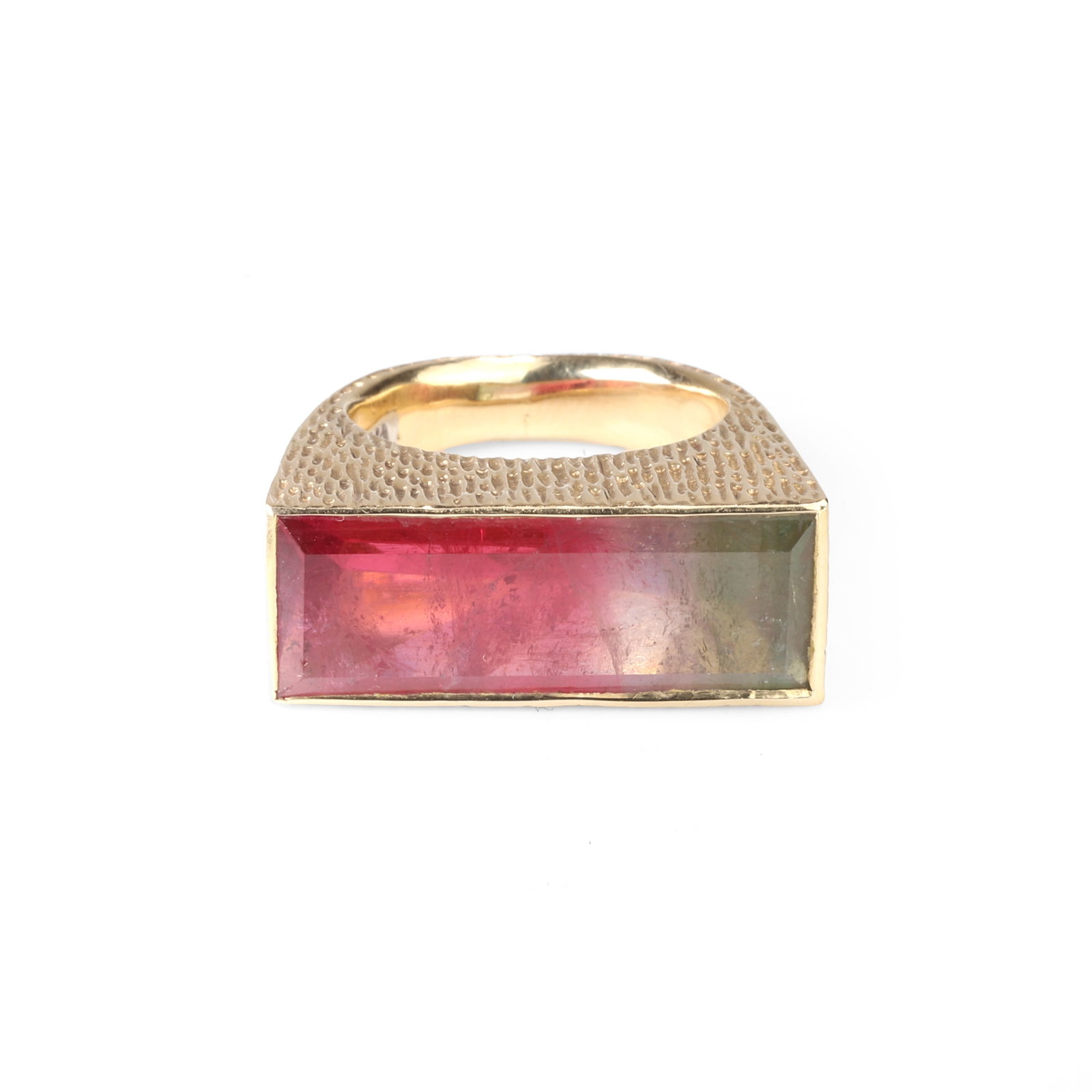 Grima, a tourmaline ring,: Grima, a tourmaline ring, the bark textured band set with an oblong rectangular cut watermelon tourmaline, signed Grima, unmarked, surface tested as approximately 18ct gold. With maker's case (Ring si