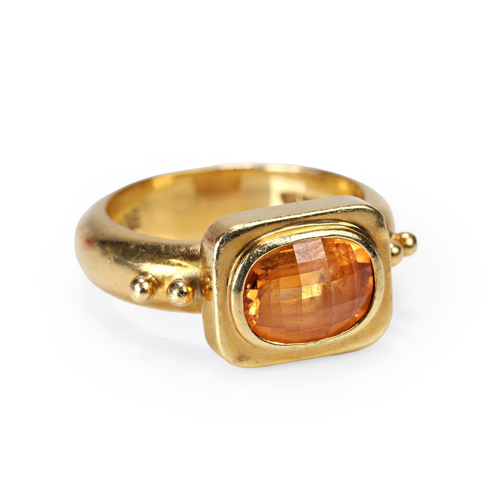 Elizabeth Gage, an 18ct gold mandarin garnet 'Valois' ring,: Elizabeth Gage, an 18ct gold mandarin garnet 'Valois' ring, collet set with an oval checkerboard cut mandarin garnet within a rectangular plaque, with granulated beads on each shoulder, leading to a p