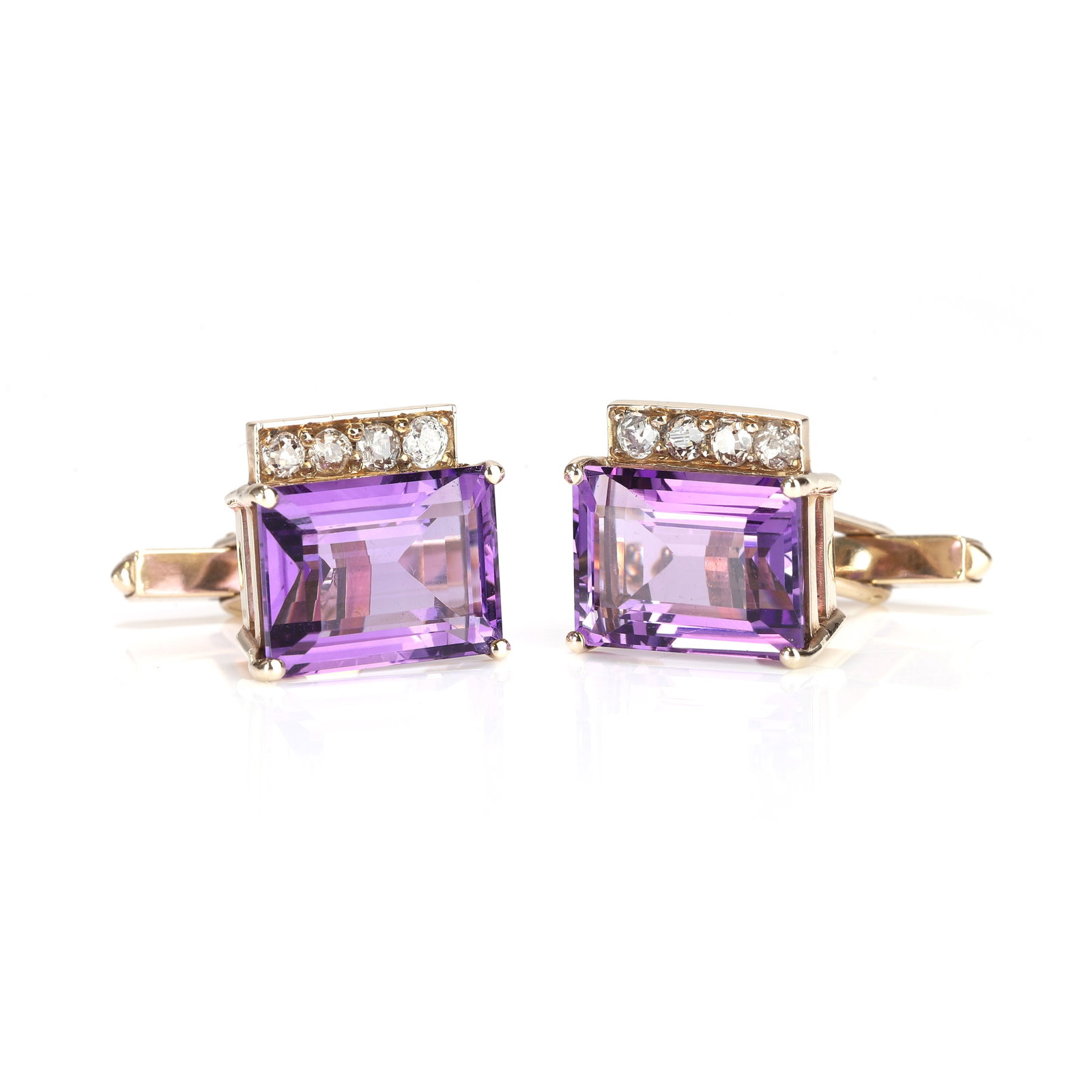 A pair of amethyst and diamond cufflinks,: A pair of amethyst and diamond cufflinks, comprising a pair of octagonal cut amethyst, claw set with a row of old cut diamonds, tread and grain set to one side with fixed swivel fittings, stamped 375,