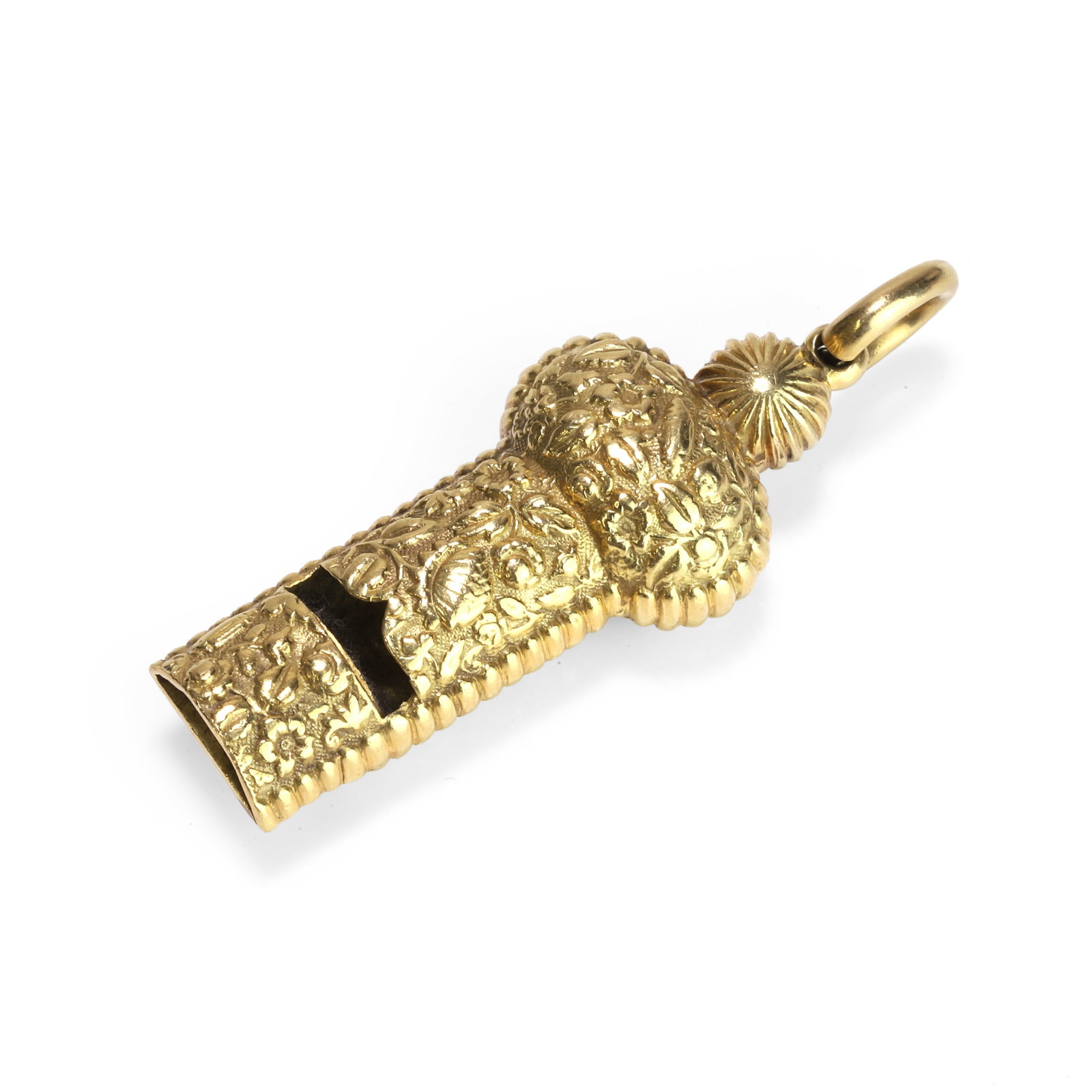 An 18ct gold whistle pendant,: An 18ct gold whistle pendant, the body heavily decorated with foliate and flower designs, to reeded sides and an oval loop bail, import hallmark for London,1993 (Length 5.8cm; 30.6g) Condition Report: