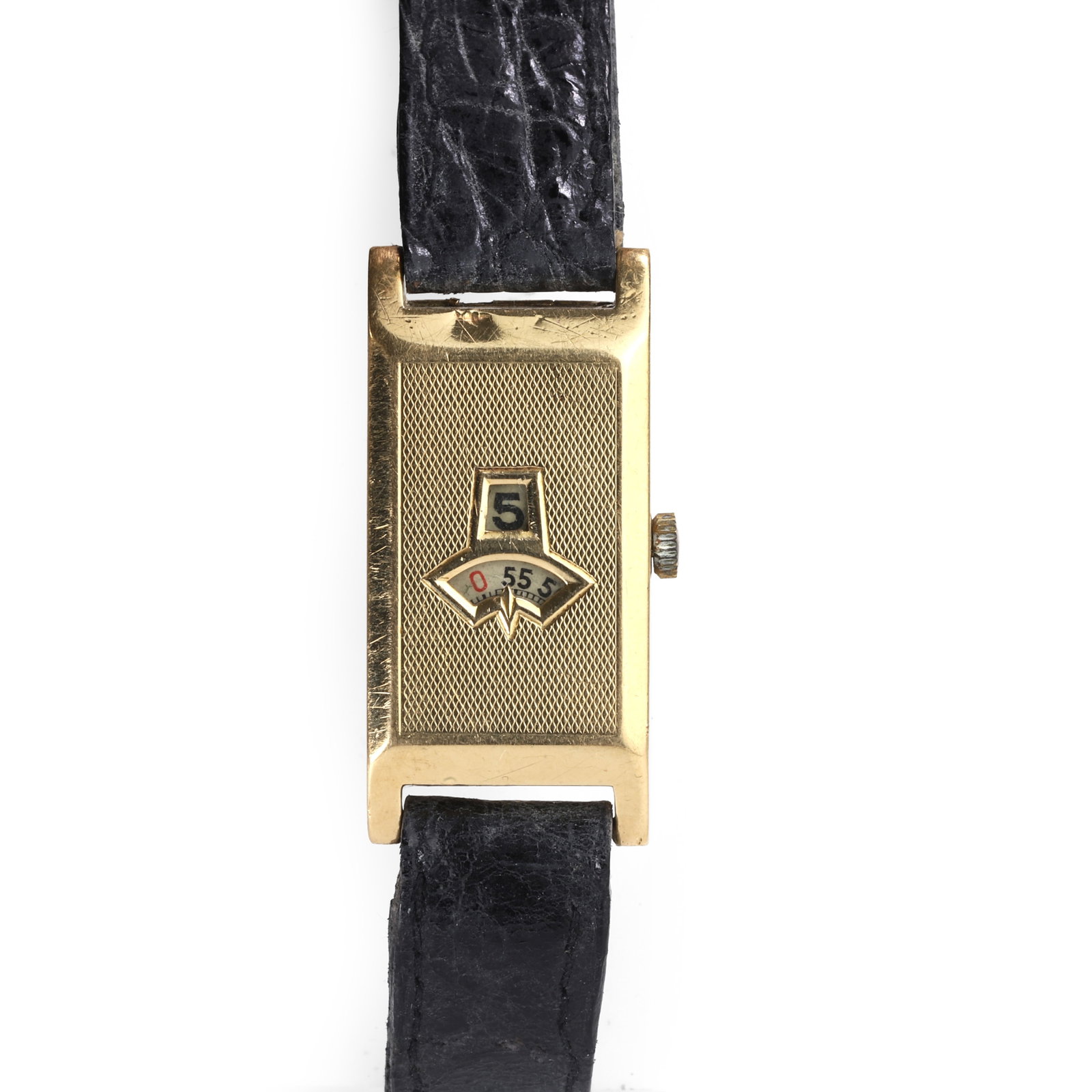 A Swiss 18ct gold jump hour mechanical strap watch, circa 1930s,: A Swiss 18ct gold jump hour mechanical strap watch, circa 1930s, the rectangular engine turned case with apertures for hour and minute dials, hinged case back numbered 502429,15 jewel manual winding m