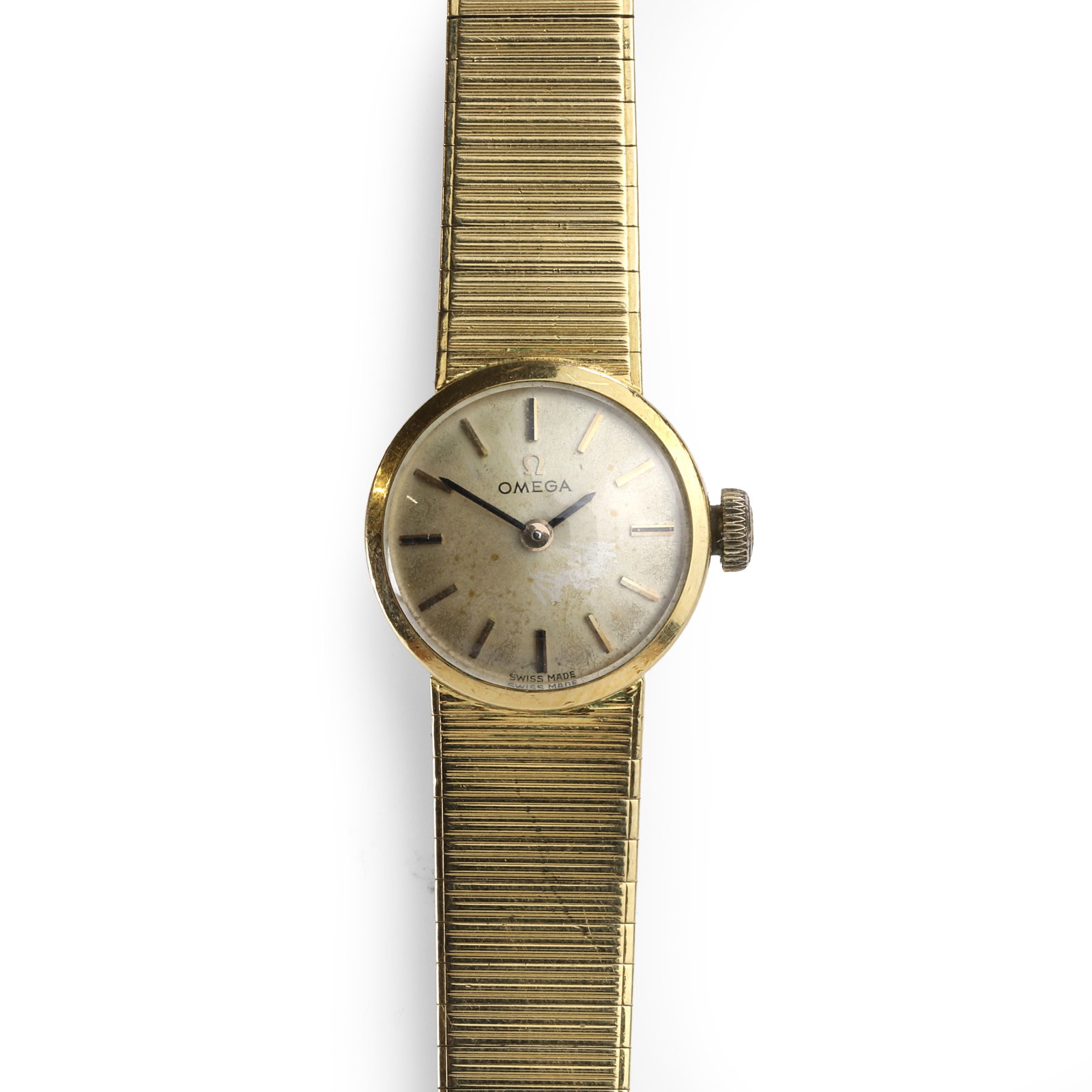 Omega, a ladies' 18ct gold mechanical bracelet watch,: Omega, a ladies' 18ct gold mechanical bracelet watch, with a circular case, a silvered dial, gilt baton hour markers, black baton hands, 17 jewel manual winding movement, movement signed 'Omega Watch 