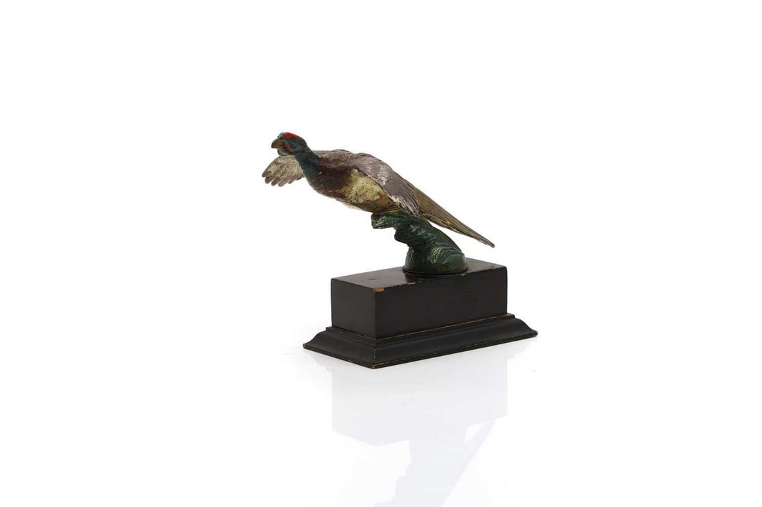 A bronze flying pheasant radiator mascot, (1 of 3)