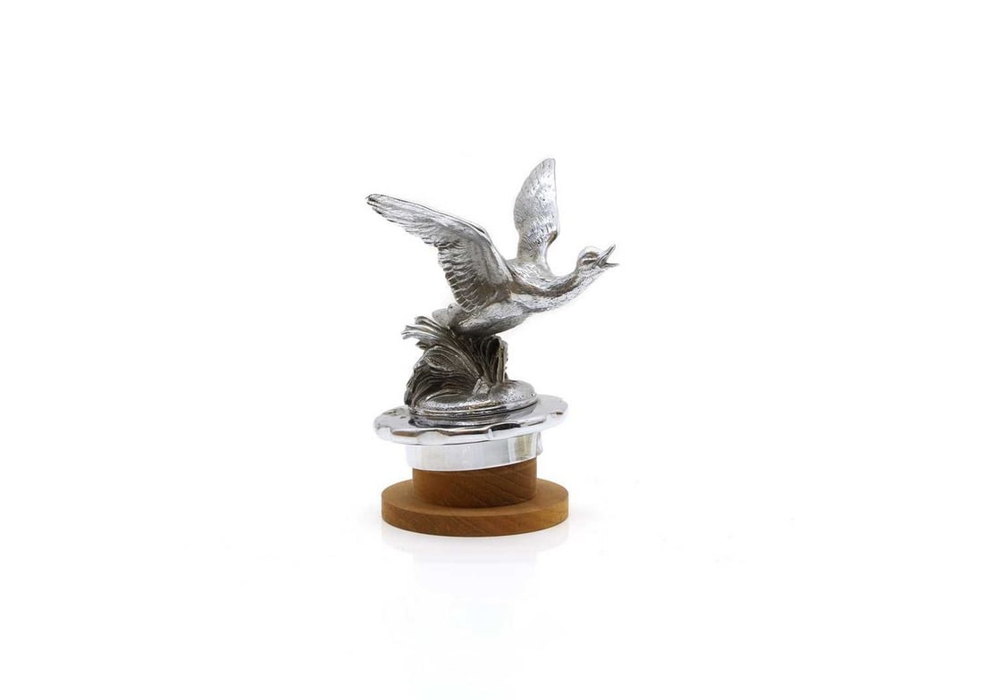 A Desmo flying goose radiator mascot, (1 of 3)