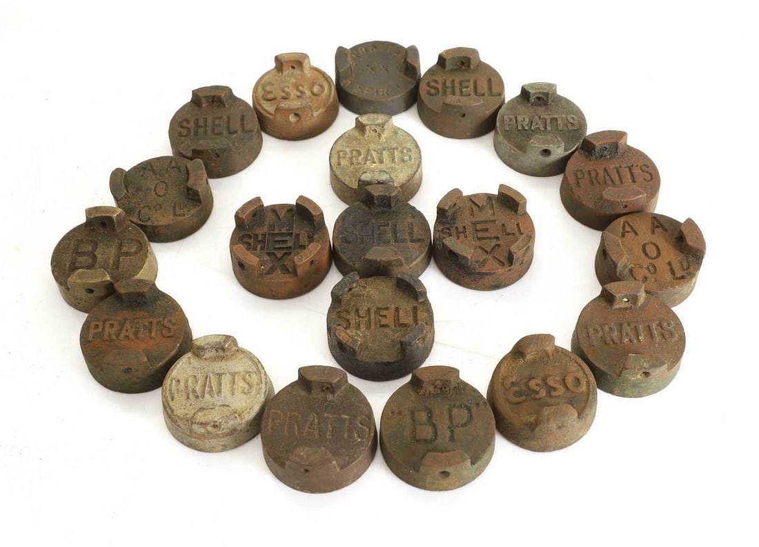A collection of pre-war petrol can lids, (1 of 2)